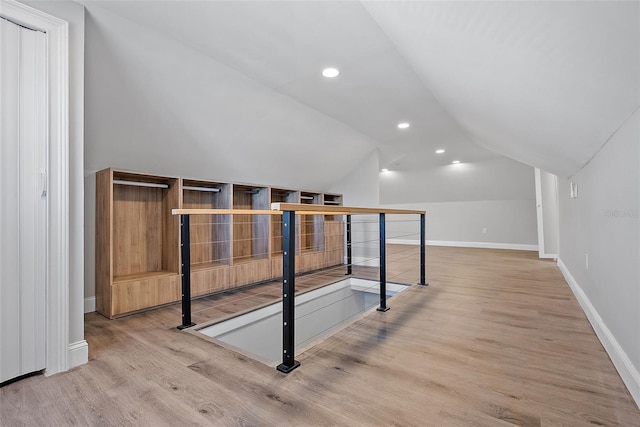 bonus room with vaulted ceiling, recessed lighting, wood finished floors, and baseboards