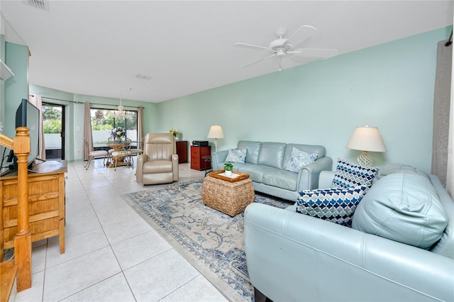 living room featuring light tile patterned floors and a ceiling fan