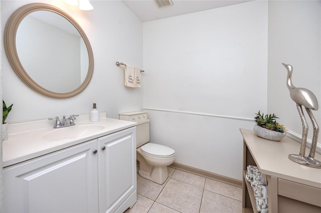 bathroom with toilet, tile patterned floors, visible vents, and vanity