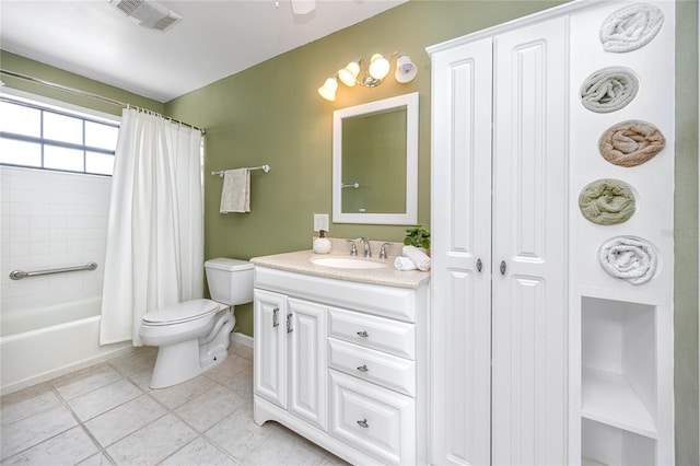 bathroom featuring toilet, vanity, visible vents, tile patterned floors, and shower / bath combination with curtain