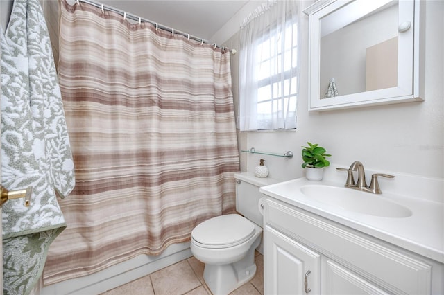 bathroom with toilet, curtained shower, tile patterned flooring, and vanity