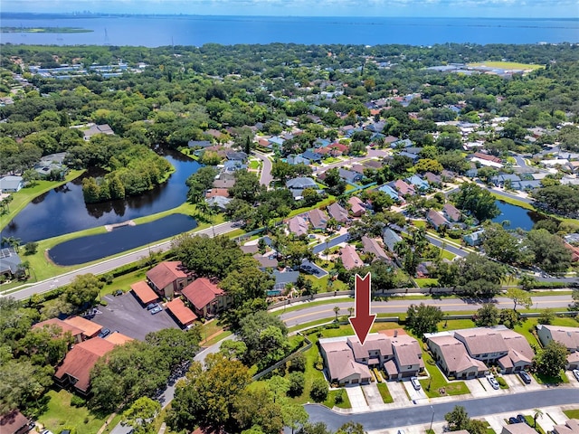 birds eye view of property featuring a water view and a residential view