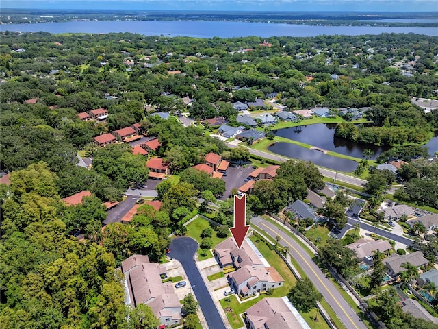 birds eye view of property with a water view and a residential view