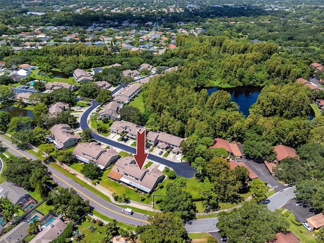 bird's eye view featuring a water view and a residential view