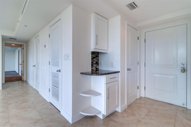 interior space featuring light tile patterned flooring