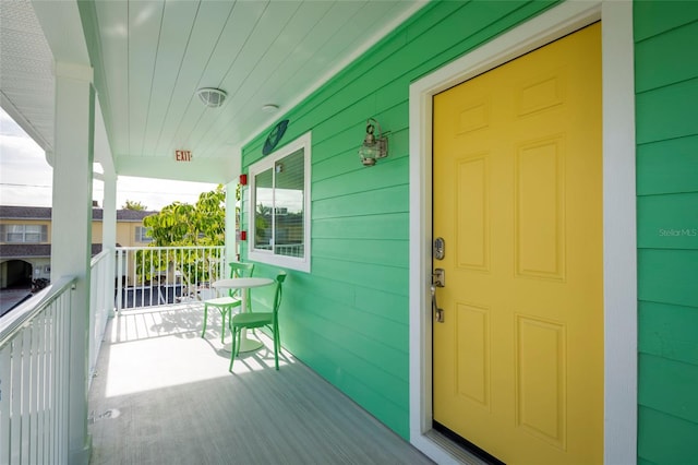 doorway to property featuring a porch