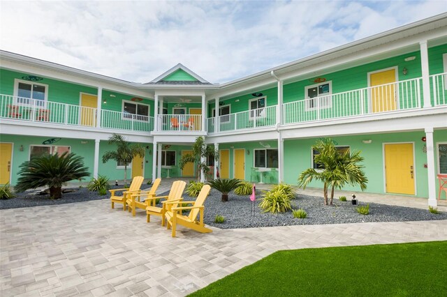 exterior space featuring a balcony and a patio