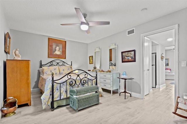 bedroom featuring ceiling fan and wood-type flooring