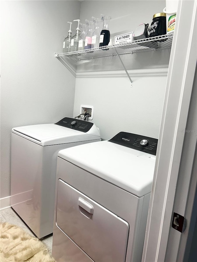 laundry area with laundry area and independent washer and dryer