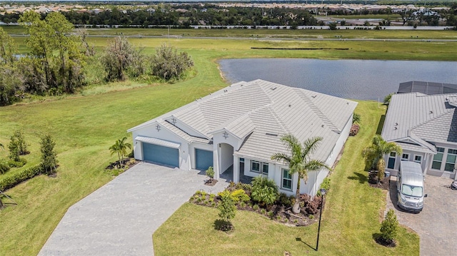 birds eye view of property with a water view