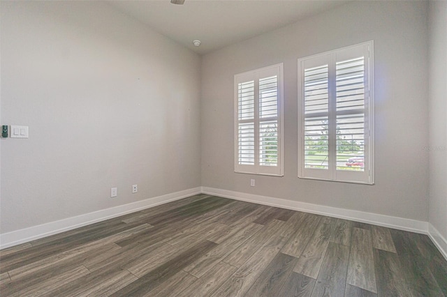 unfurnished room featuring dark hardwood / wood-style floors