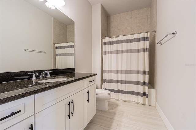 full bathroom featuring vanity, toilet, and shower / tub combo