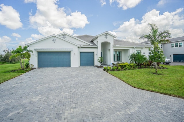 view of front facade with a front yard and a garage