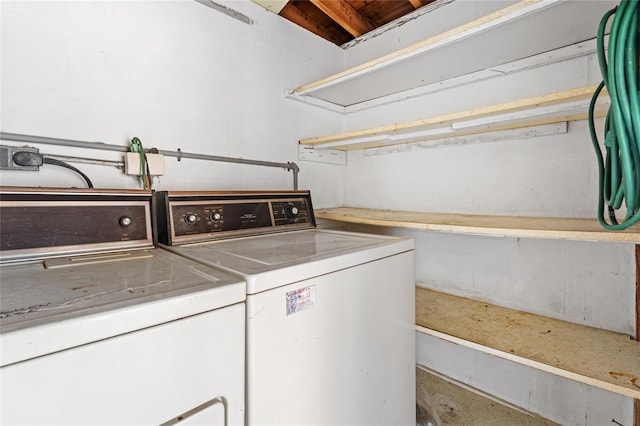 washroom featuring washer and clothes dryer