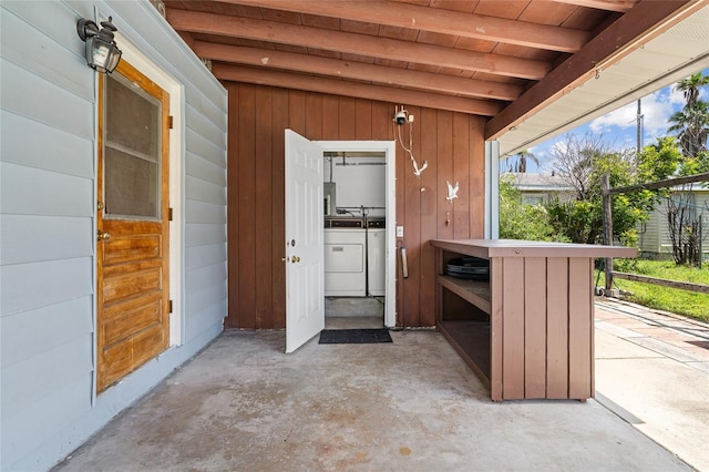 exterior space featuring washer and clothes dryer