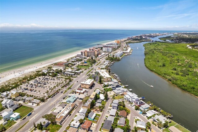 birds eye view of property with a view of the beach and a water view