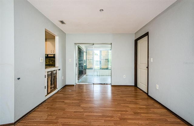 empty room with wood-type flooring