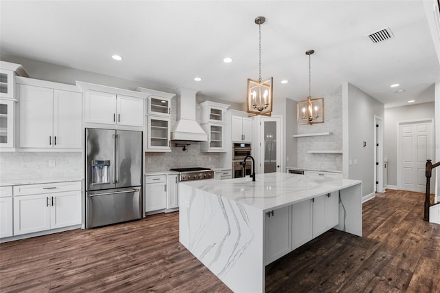 kitchen featuring premium range hood, stainless steel appliances, white cabinetry, a large island, and dark wood-type flooring