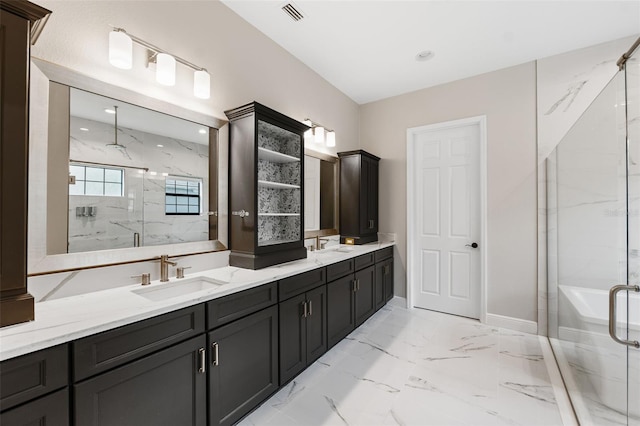 bathroom with vanity and an enclosed shower