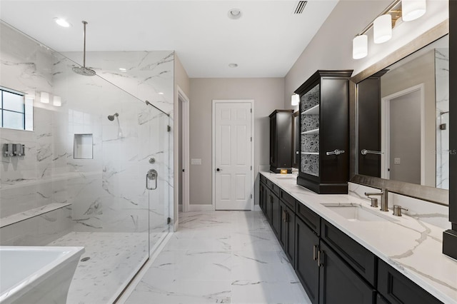 bathroom with vanity and an enclosed shower