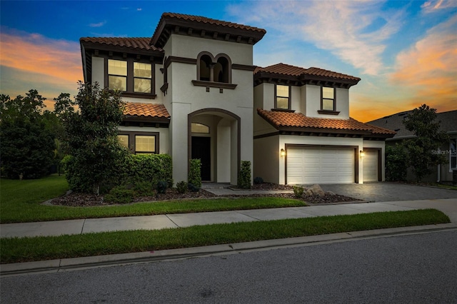 mediterranean / spanish house featuring a garage