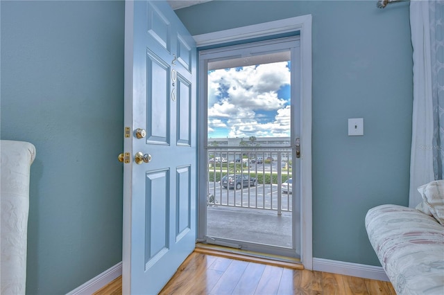 doorway to outside with light hardwood / wood-style floors