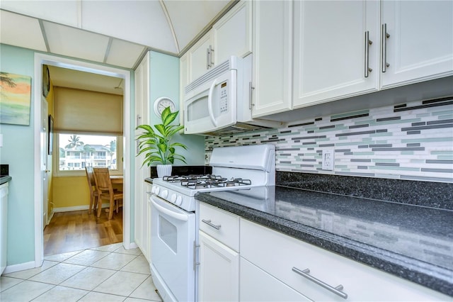 kitchen featuring white cabinets, white appliances, decorative backsplash, and light hardwood / wood-style flooring