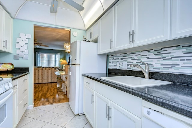 kitchen featuring white appliances, tasteful backsplash, white cabinetry, ceiling fan, and light wood-type flooring