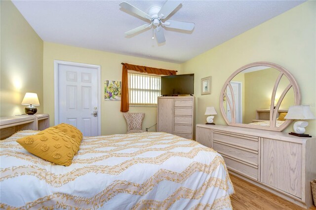 bedroom featuring light wood-type flooring and ceiling fan