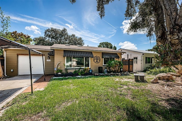 single story home with a front yard and a garage