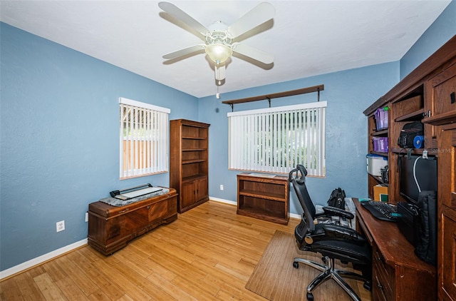 office featuring light wood-type flooring and ceiling fan