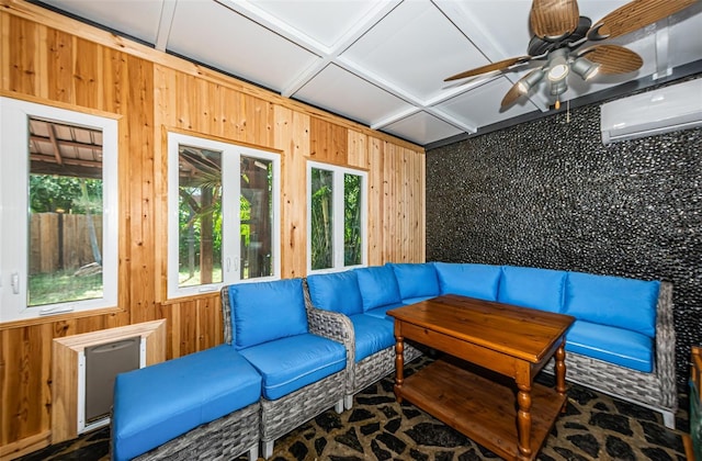 sunroom featuring coffered ceiling, ceiling fan, and an AC wall unit