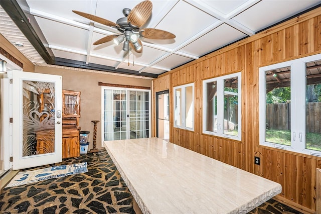 sunroom featuring coffered ceiling and ceiling fan