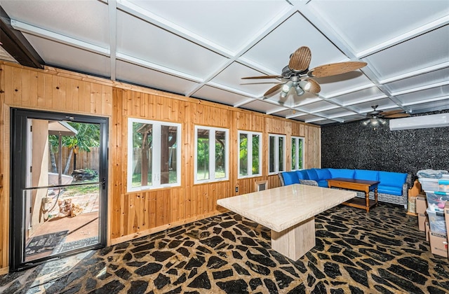 interior space featuring coffered ceiling and ceiling fan