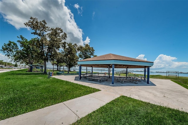 view of home's community featuring a water view, a yard, and a gazebo