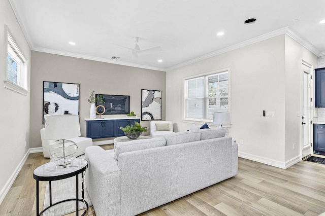 living room featuring ceiling fan, light hardwood / wood-style floors, and ornamental molding