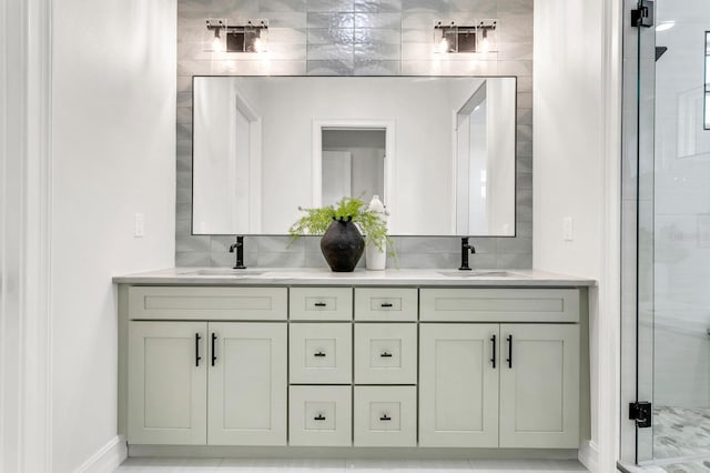 full bath with double vanity, backsplash, a sink, and a shower stall