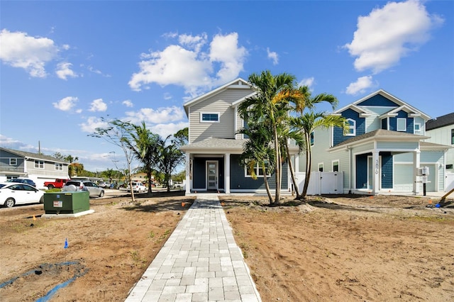 view of front of house with a porch and a garage