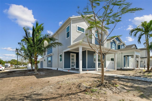 back of property with a porch