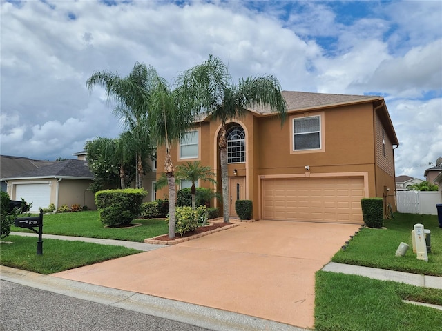 view of front facade with a front lawn and a garage