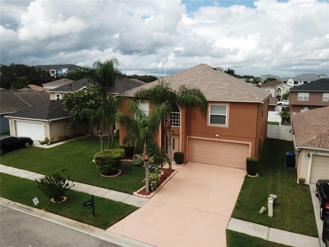 view of front facade with a front yard and a garage