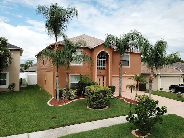 view of front of home featuring a garage and a front lawn