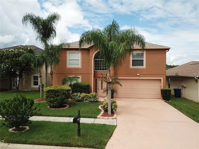 view of front of house featuring a garage and a front yard