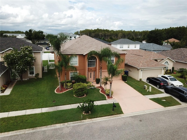 view of front facade with a garage and a front yard