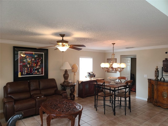 tiled dining space with a textured ceiling, crown molding, and ceiling fan with notable chandelier