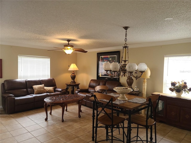 dining area featuring a textured ceiling, plenty of natural light, ceiling fan, and light tile patterned flooring