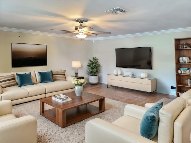 living room with light wood-type flooring, ceiling fan, and ornamental molding