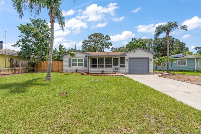 single story home with concrete driveway, a front lawn, an attached garage, and fence