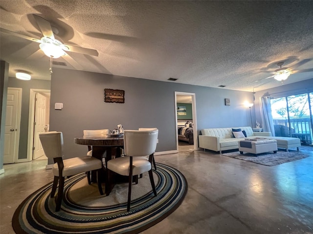 dining space with a textured ceiling, ceiling fan, and concrete flooring