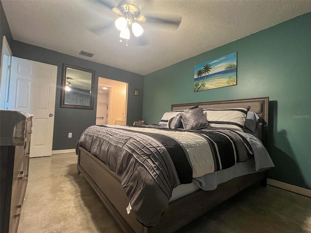 bedroom with a textured ceiling and ceiling fan